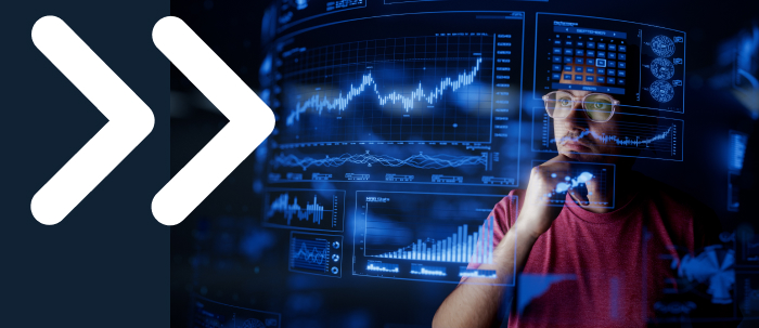 Economista con énfasis en análisis de datos trabaja en entorno empresarial y revisa gráficos en pantalla 