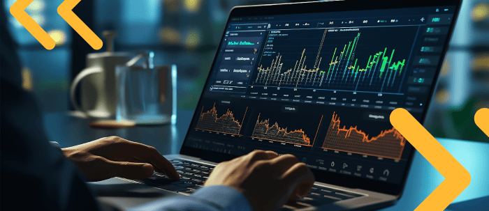 Profesional analiza comportamiento de mercados financieros en su laptop