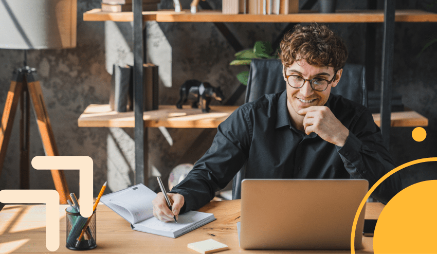 Estudiante universitario analizando gráficas económicas en su computadora para decidir si estudiar economía